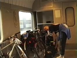 Julian secures the bikes in the train ready for our journey up into the mountains